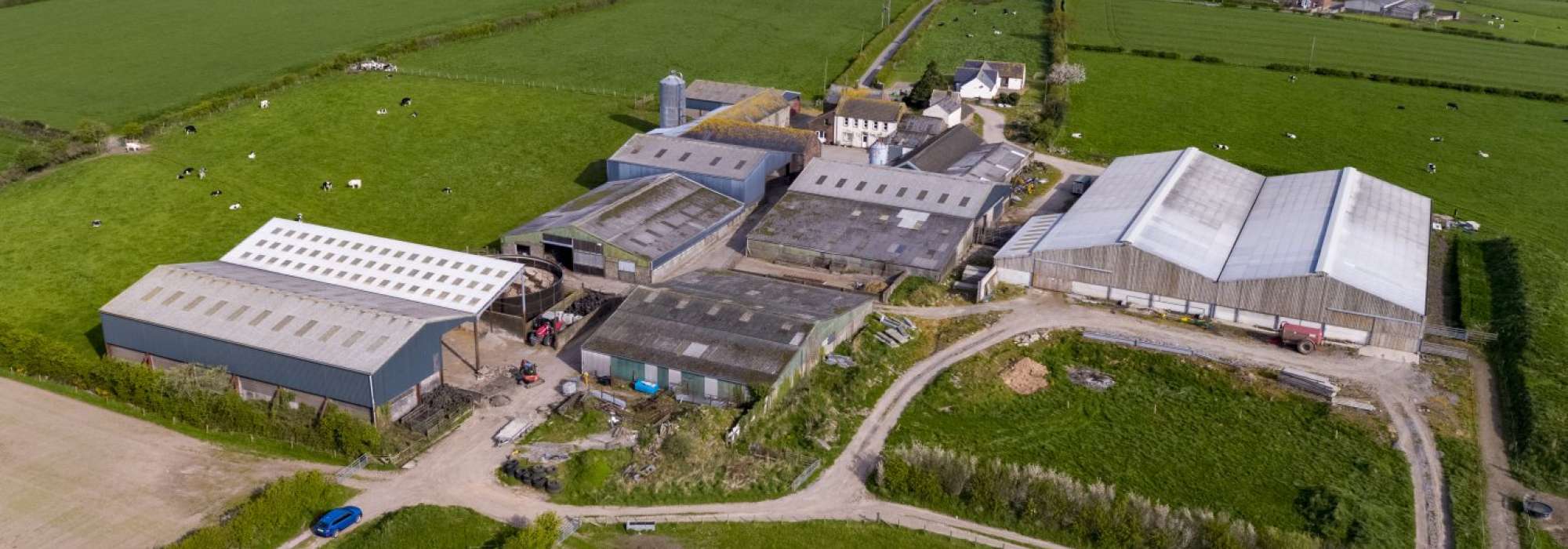 Farm buildings in a field