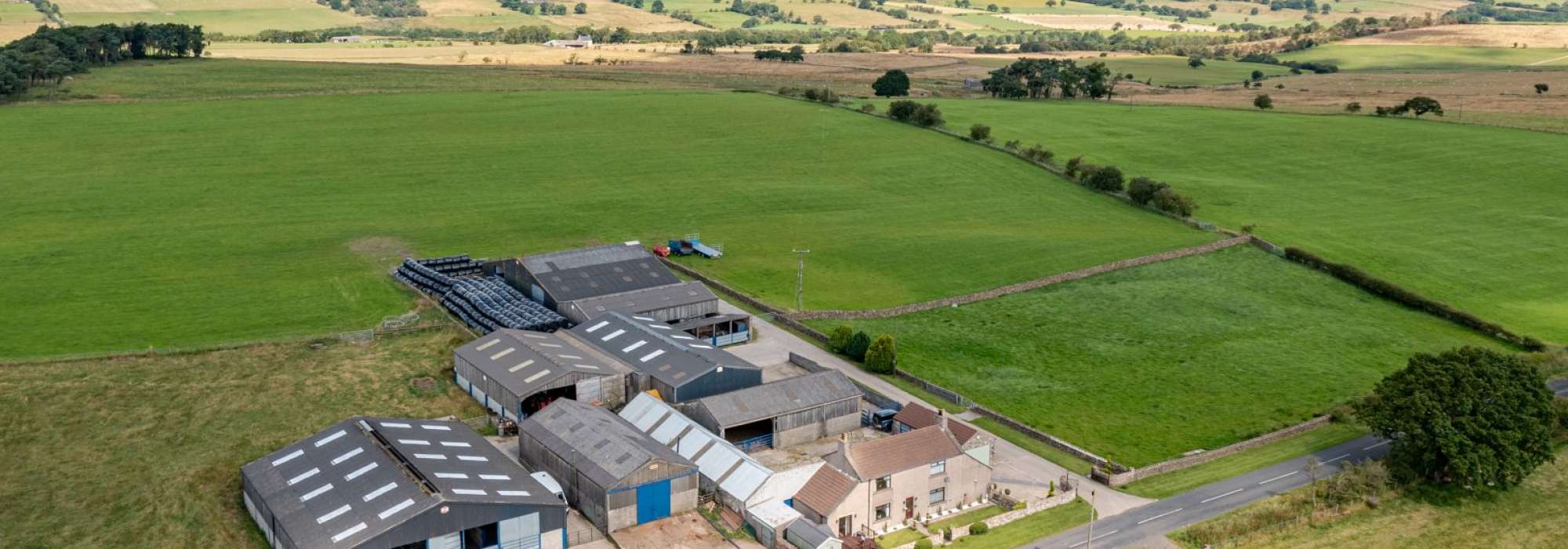 ARiel shot of farm building within a field