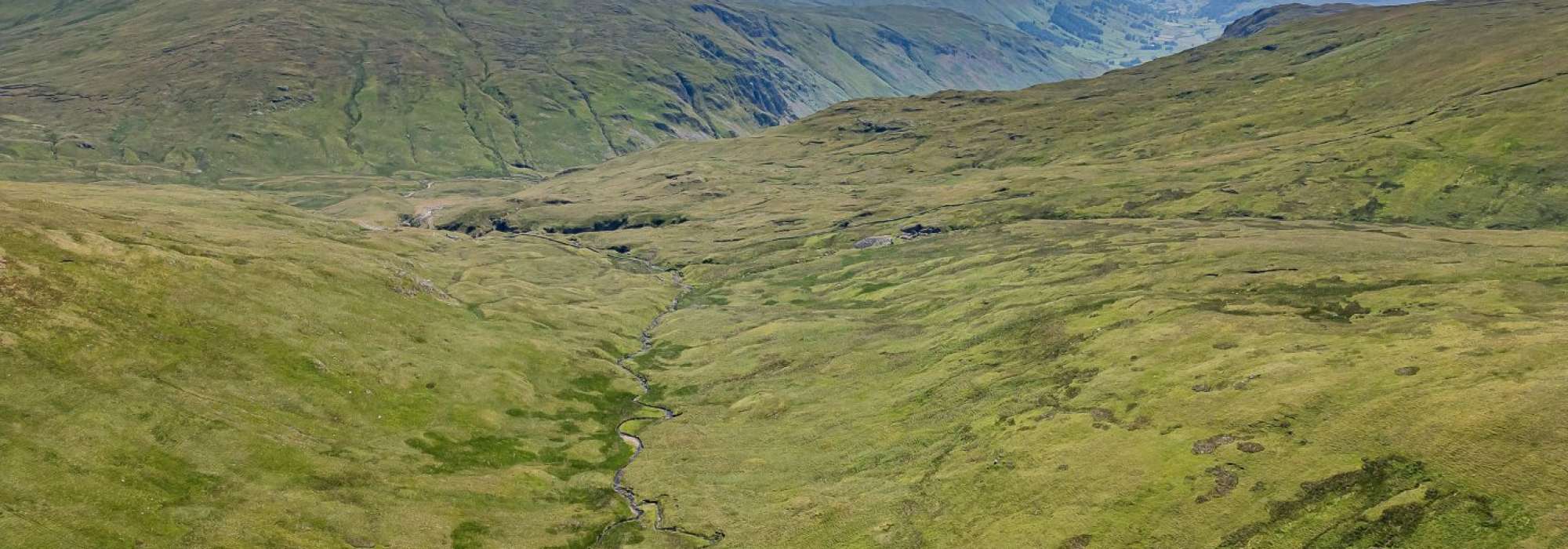 Large area of land with hills and blue skies