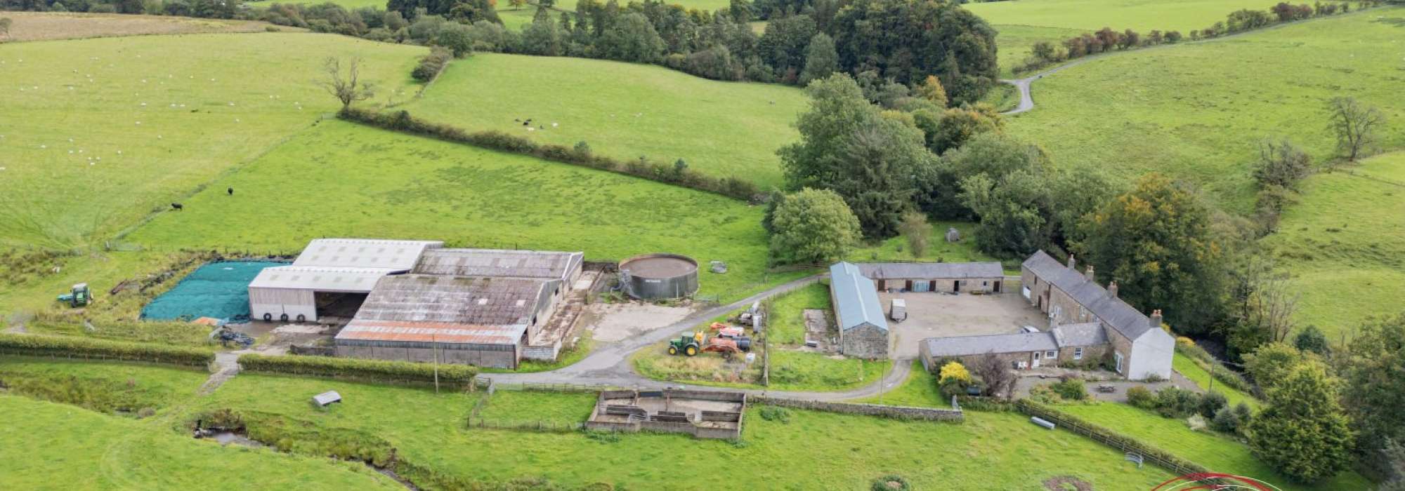 Large farm surrounded by fields.