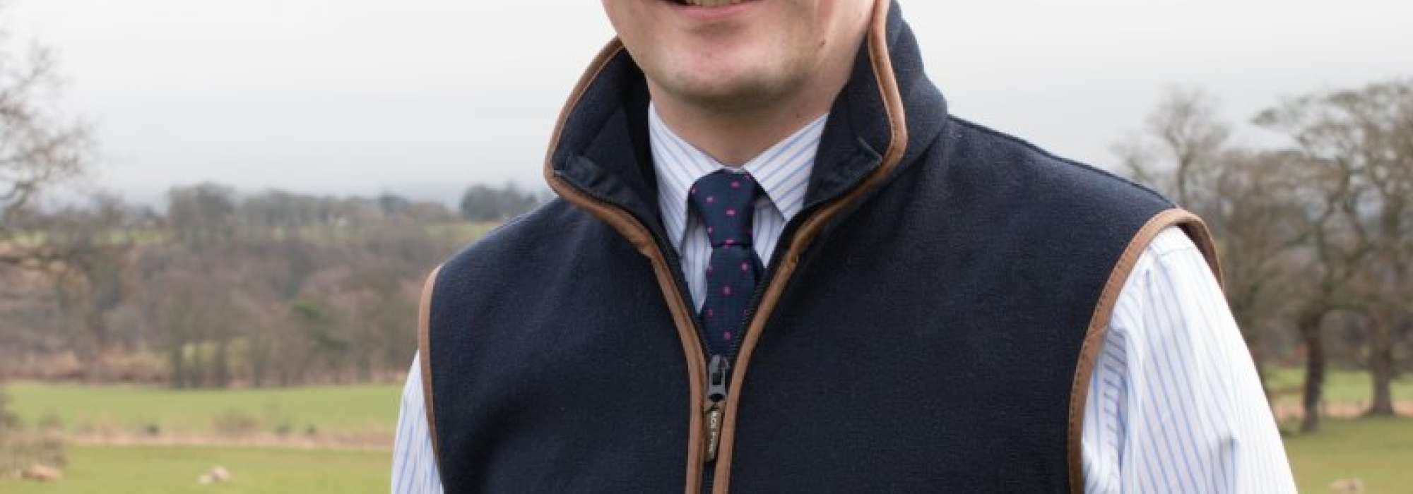 man standing outside smiling